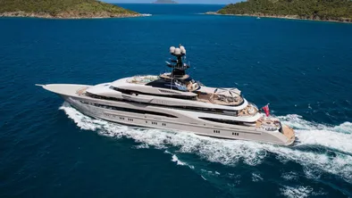 Snapshot of Kismet, a monumental 95.2-metre Lürssen superyacht, sailing on the sea.