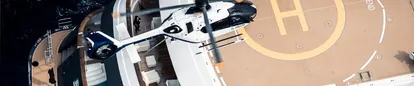 Helicopter approaching helipad on yacht at the Monaco Yacht Show