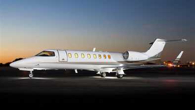 Bombardier Learjet 45 parked at airport in darkness