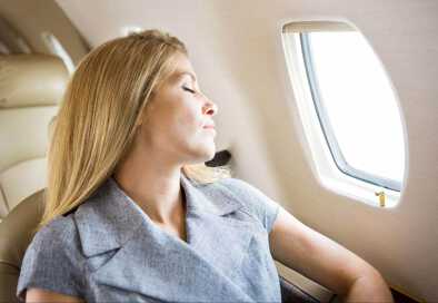 Women in a private jet enjoying a relaxing trip Women in a private jet enjoying a relaxing trip